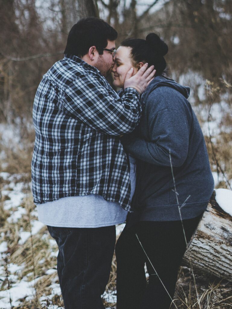 couples using gottman therapy and showing physical affection by kissing foreheads. 